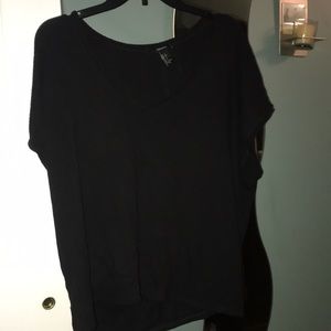 Black v-neck shirt.
